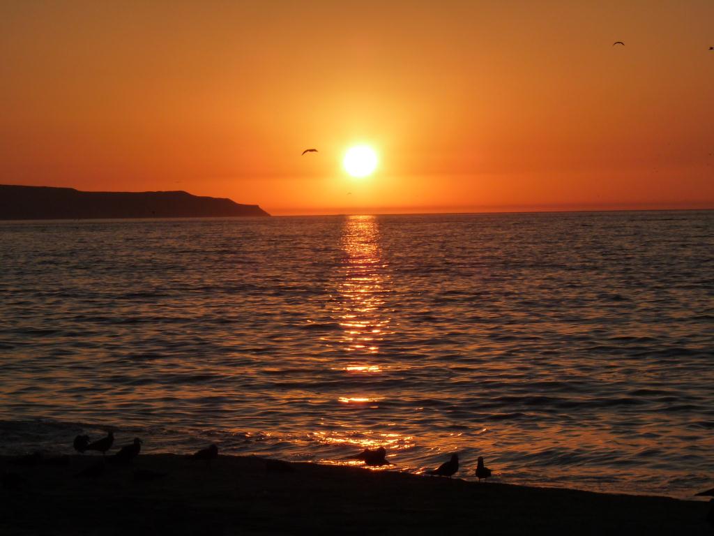 Chile: Sunset over our beach campsite