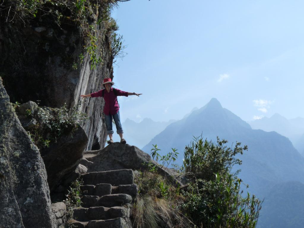 Peru: Climbing Waynapicchu towering above Machu Picchu (2700m)