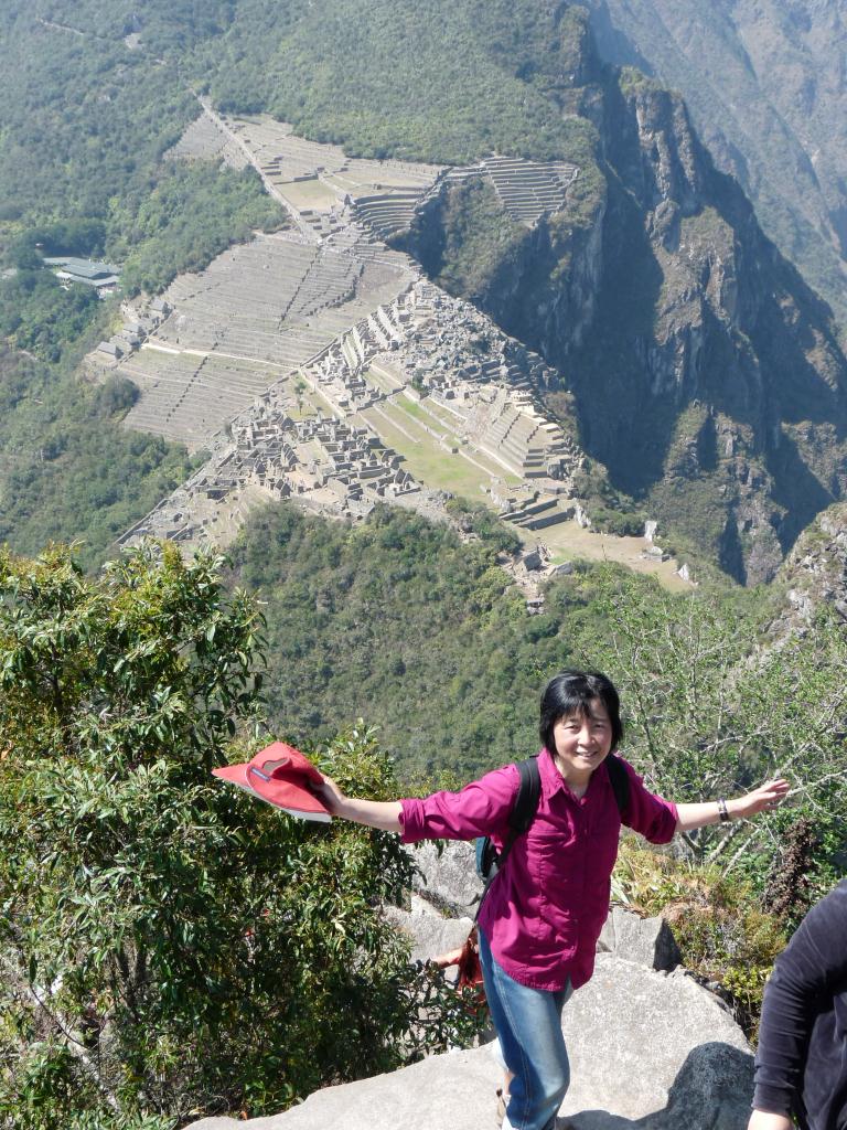 Peru: Waynapicchu towering above Machu Picchu (2700m)