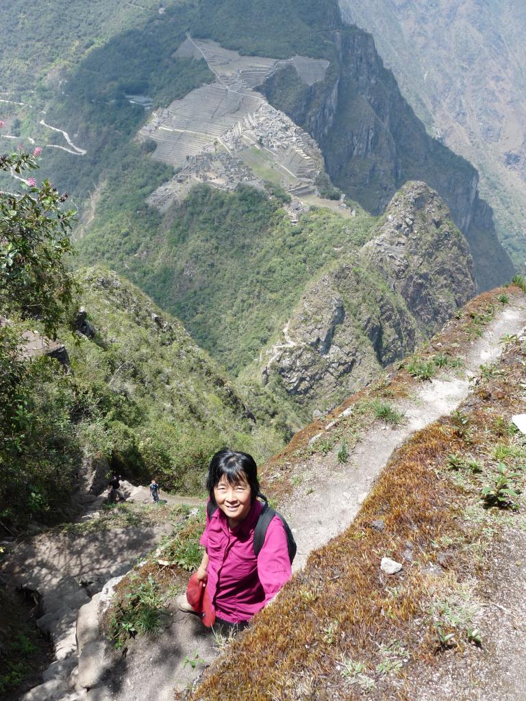 Peru: Waynapicchu towering above Machu Picchu (2700m)