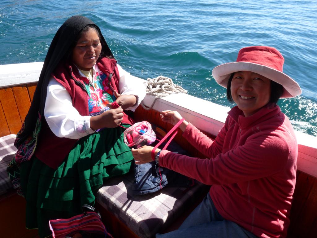 Peru: Passing time on the three hour boat ride back to Puno